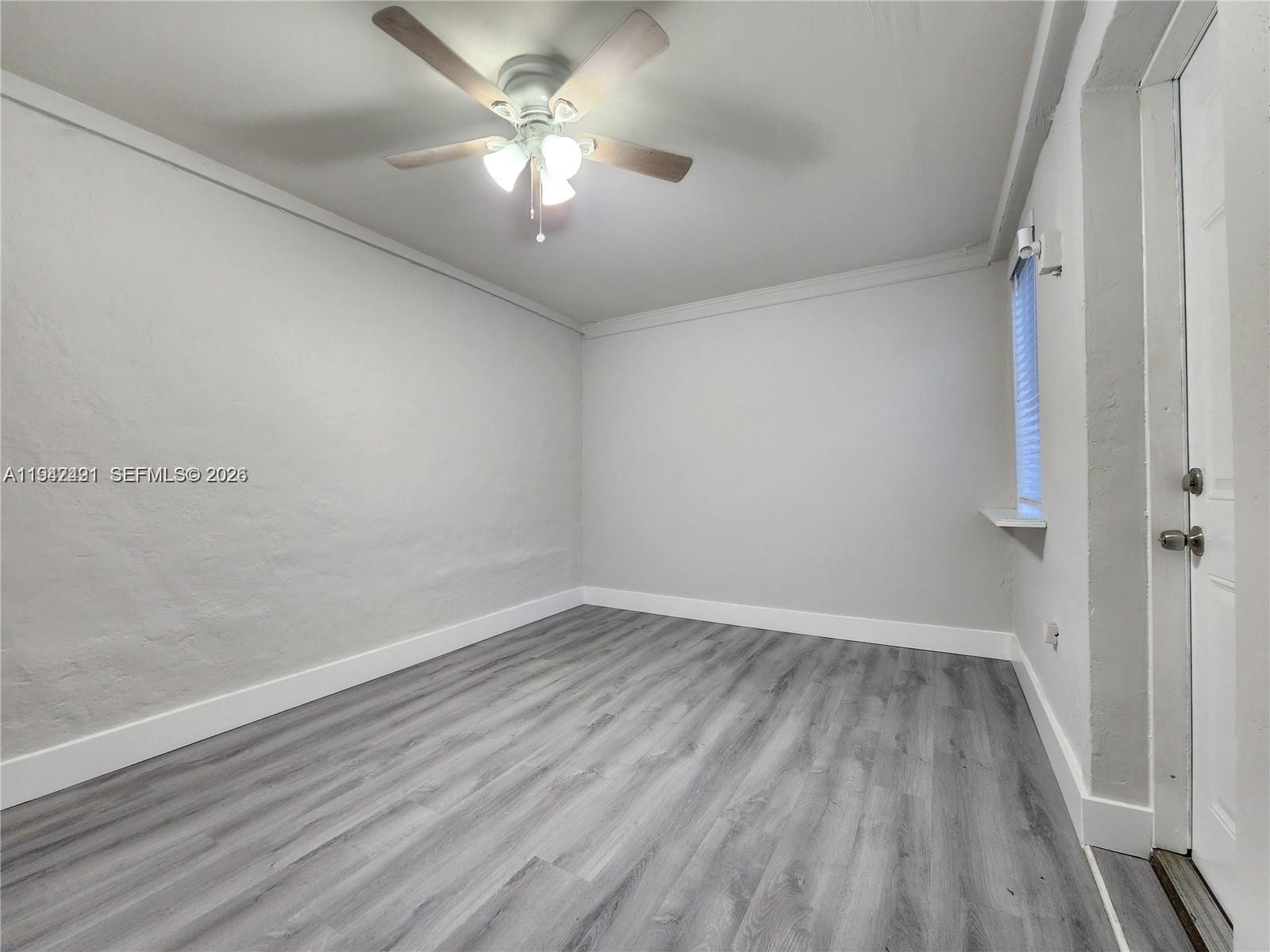 8295 Northeast 3rd Avenue, Unit 3 Miami, FL 33138 - Photo 2 of 7 wooden floor in an empty room