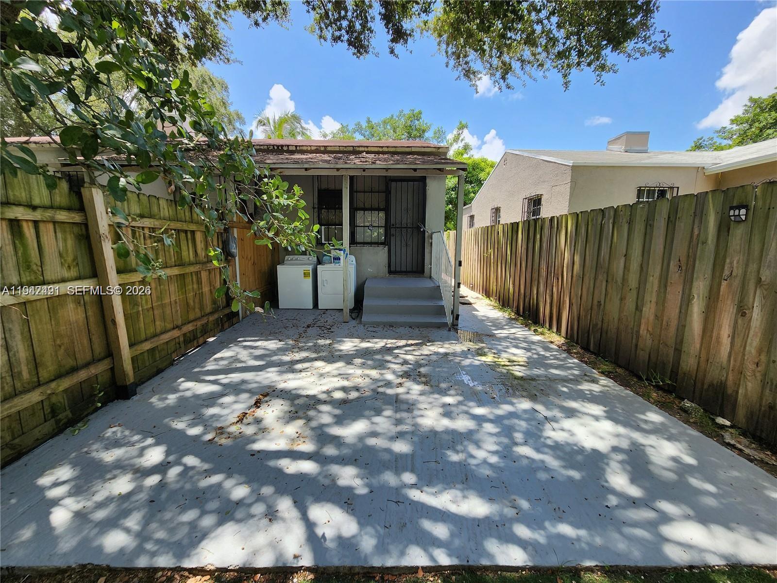 8295 Northeast 3rd Avenue, Unit 3 Miami, FL 33138 - Photo 7 of 7 a front view of a house with a porch