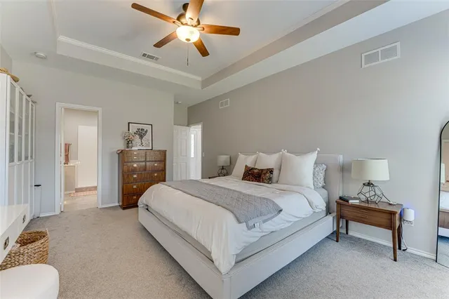 a bedroom with bed and window