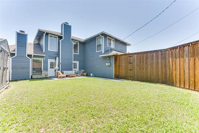 a view of an house with backyard and bathroom