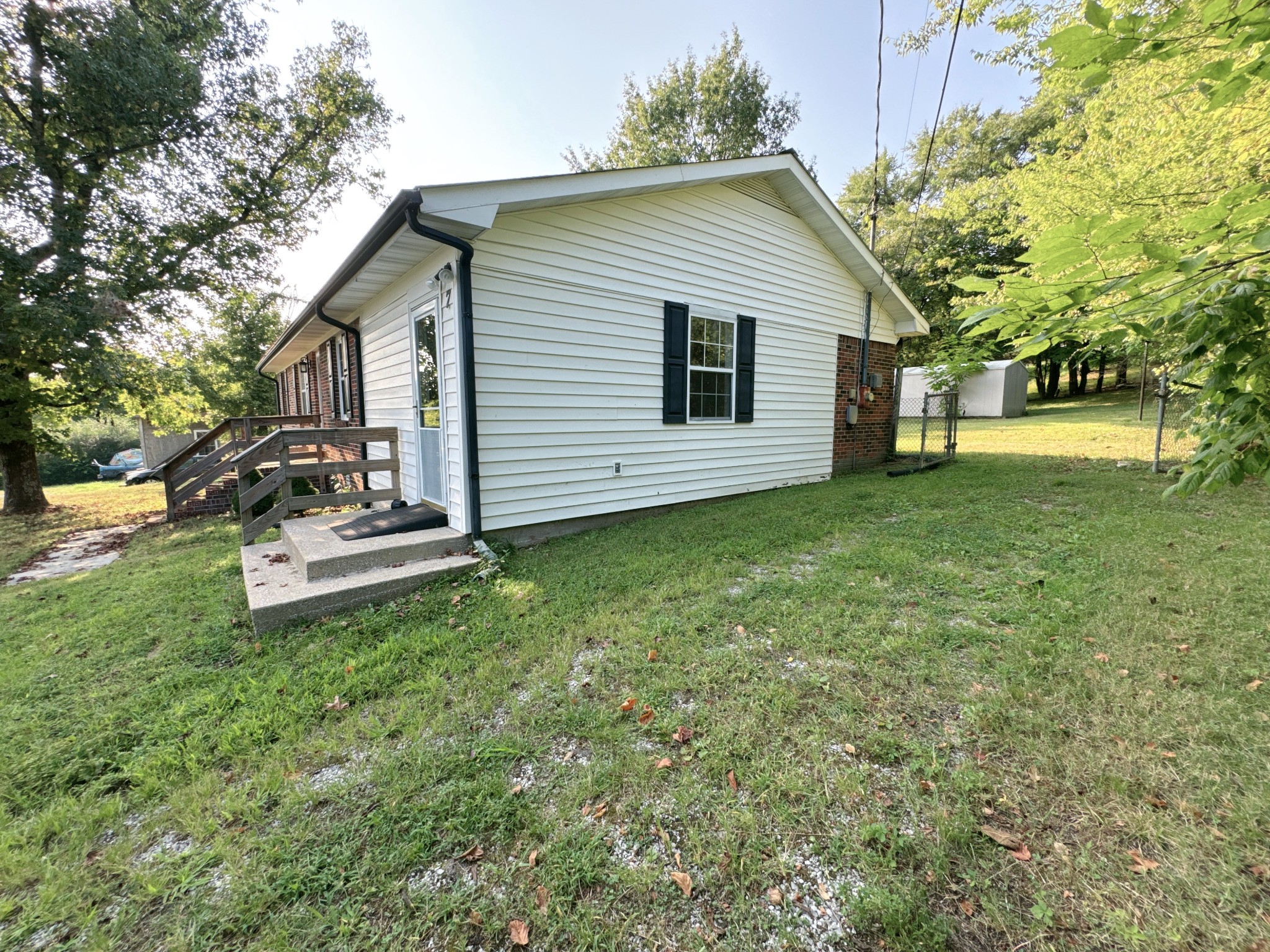 7 Switchboard Road Brush Creek, TN 38547 - Photo 20 of 20 a front view of a house with a garden