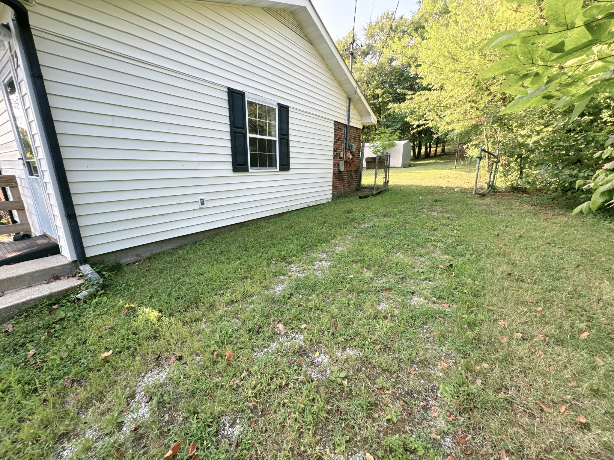 7 Switchboard Road Brush Creek, TN 38547 - Photo 3 of 20 a view of a backyard with a garden