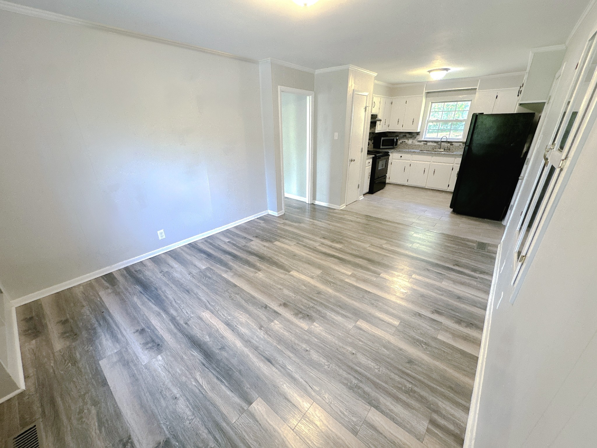 7 Switchboard Road Brush Creek, TN 38547 - Photo 5 of 20 a view of a refrigerator in kitchen and wooden floor