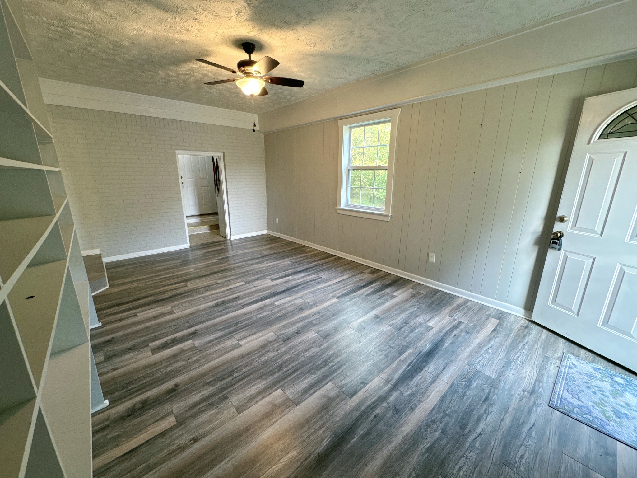 7 Switchboard Road Brush Creek, TN 38547 - Photo 8 of 20 a view of an empty room with a window and wooden floor