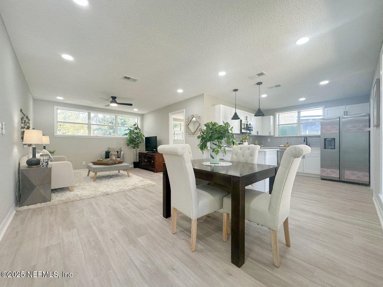 1336 Morgana Road Jacksonville, FL 32211 - Photo 12 of 36 a view of a dining room with furniture and wooden floor