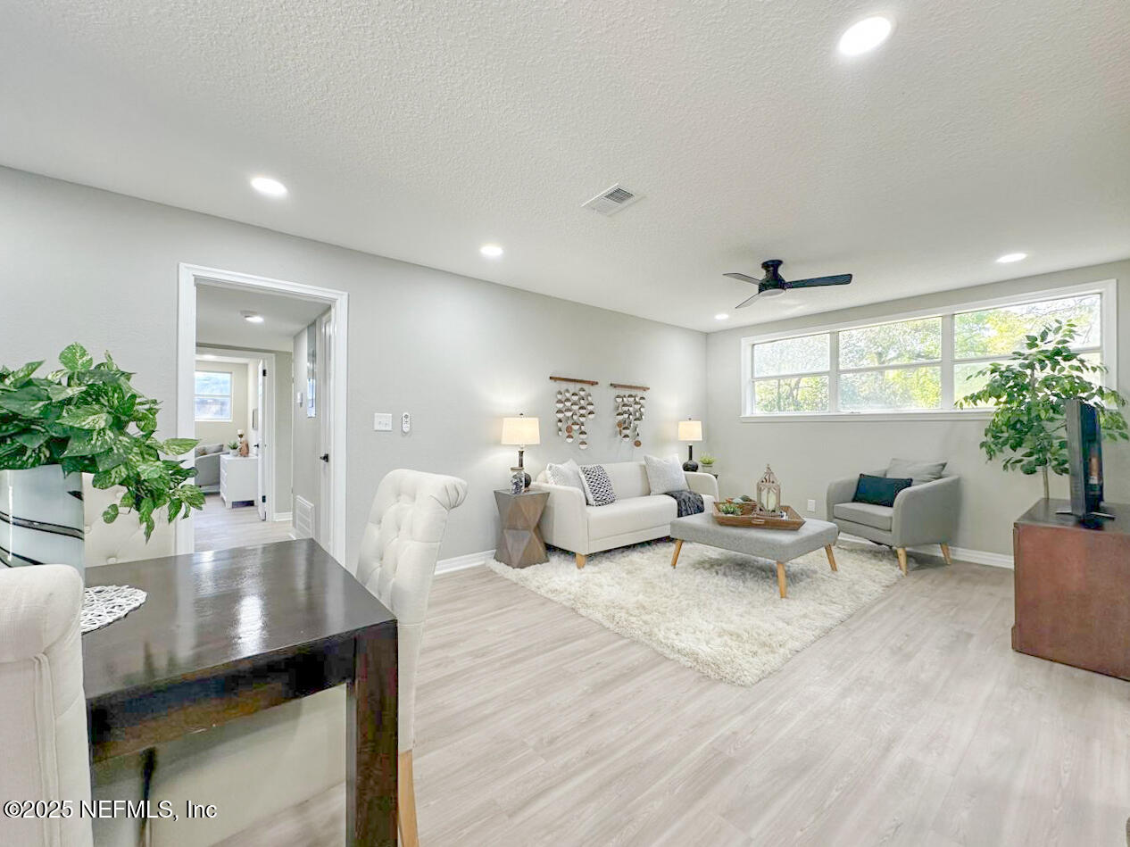 1336 Morgana Road Jacksonville, FL 32211 - Photo 14 of 36 a living room with furniture and a potted plant