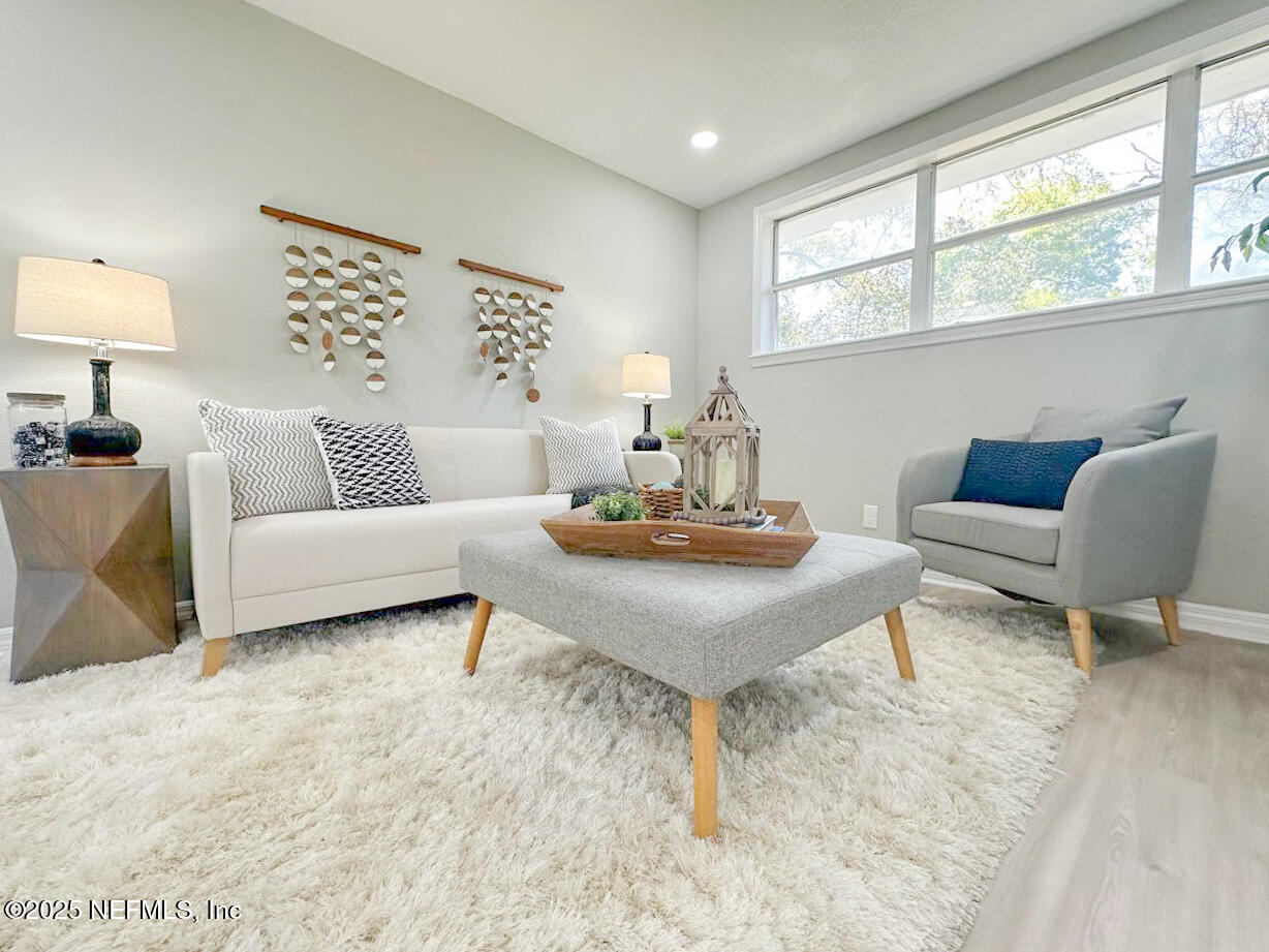 1336 Morgana Road Jacksonville, FL 32211 - Photo 16 of 36 a living room with furniture and a table