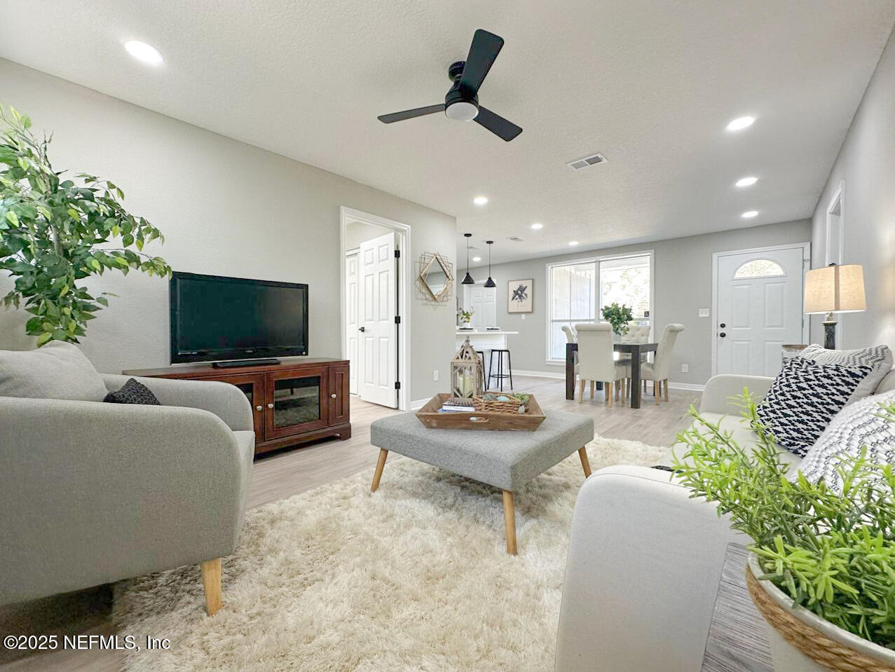 1336 Morgana Road Jacksonville, FL 32211 - Photo 17 of 36 a living room with furniture and a flat screen tv