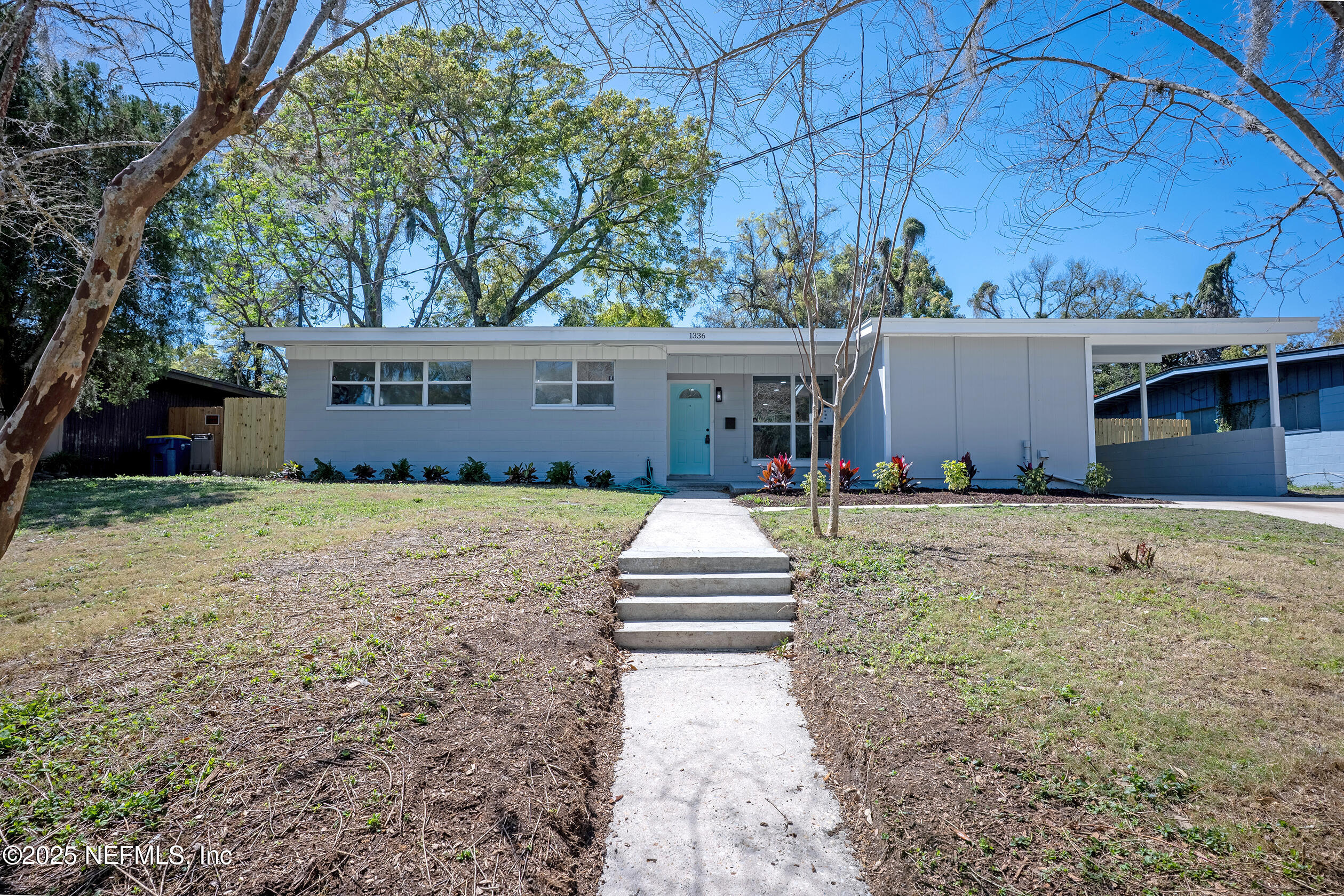 1336 Morgana Road Jacksonville, FL 32211 - Photo 2 of 36 a front view of a house with a yard