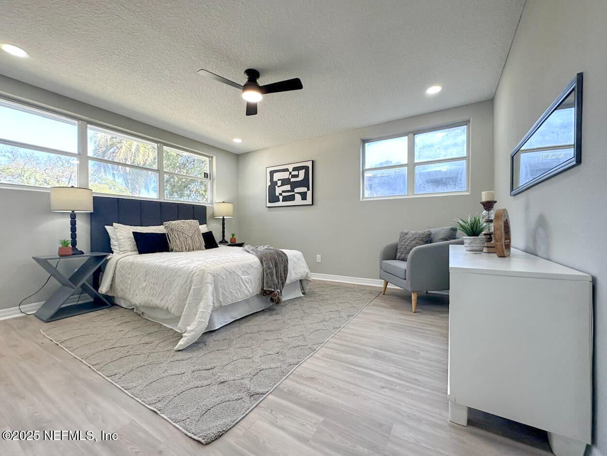 1336 Morgana Road Jacksonville, FL 32211 - Photo 26 of 36 a bedroom with a bed and a large window