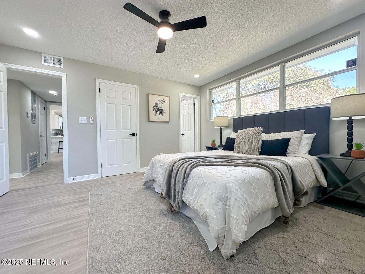 1336 Morgana Road Jacksonville, FL 32211 - Photo 27 of 36 a spacious bedroom with a bed and large window