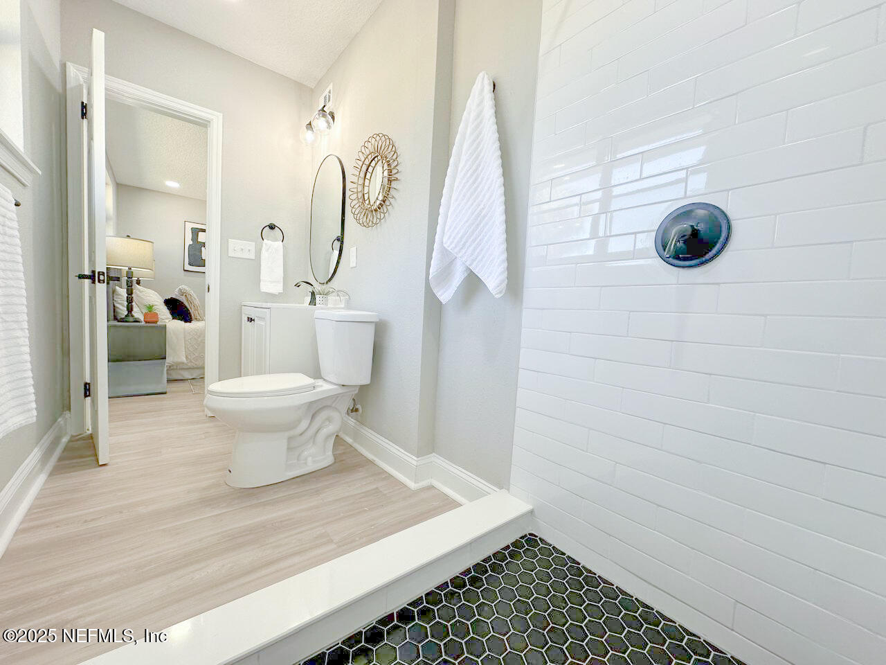 1336 Morgana Road Jacksonville, FL 32211 - Photo 28 of 36 a bathroom with a sink toilet and shower