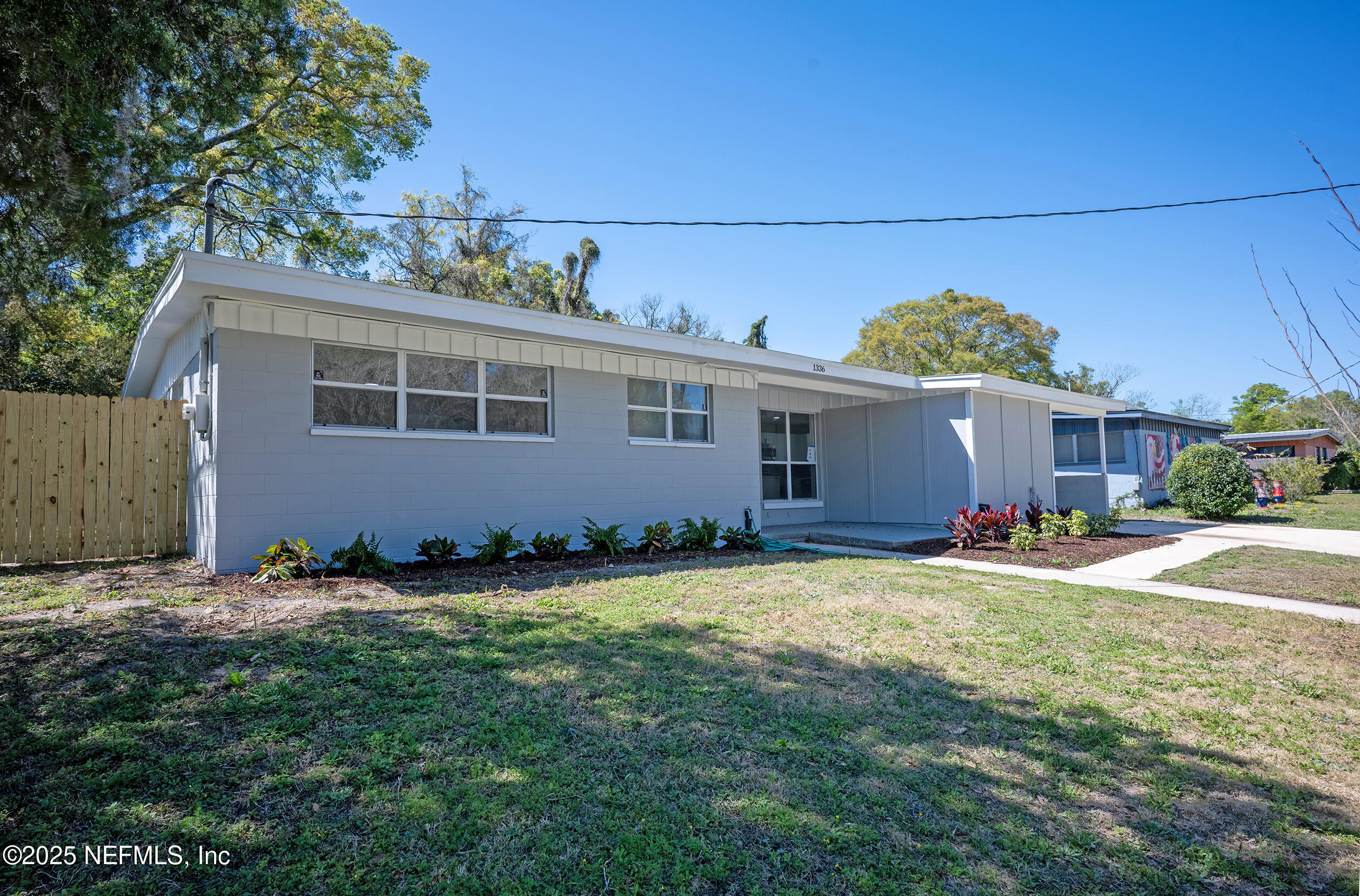 1336 Morgana Road Jacksonville, FL 32211 - Photo 3 of 36 front view of a house with a yard