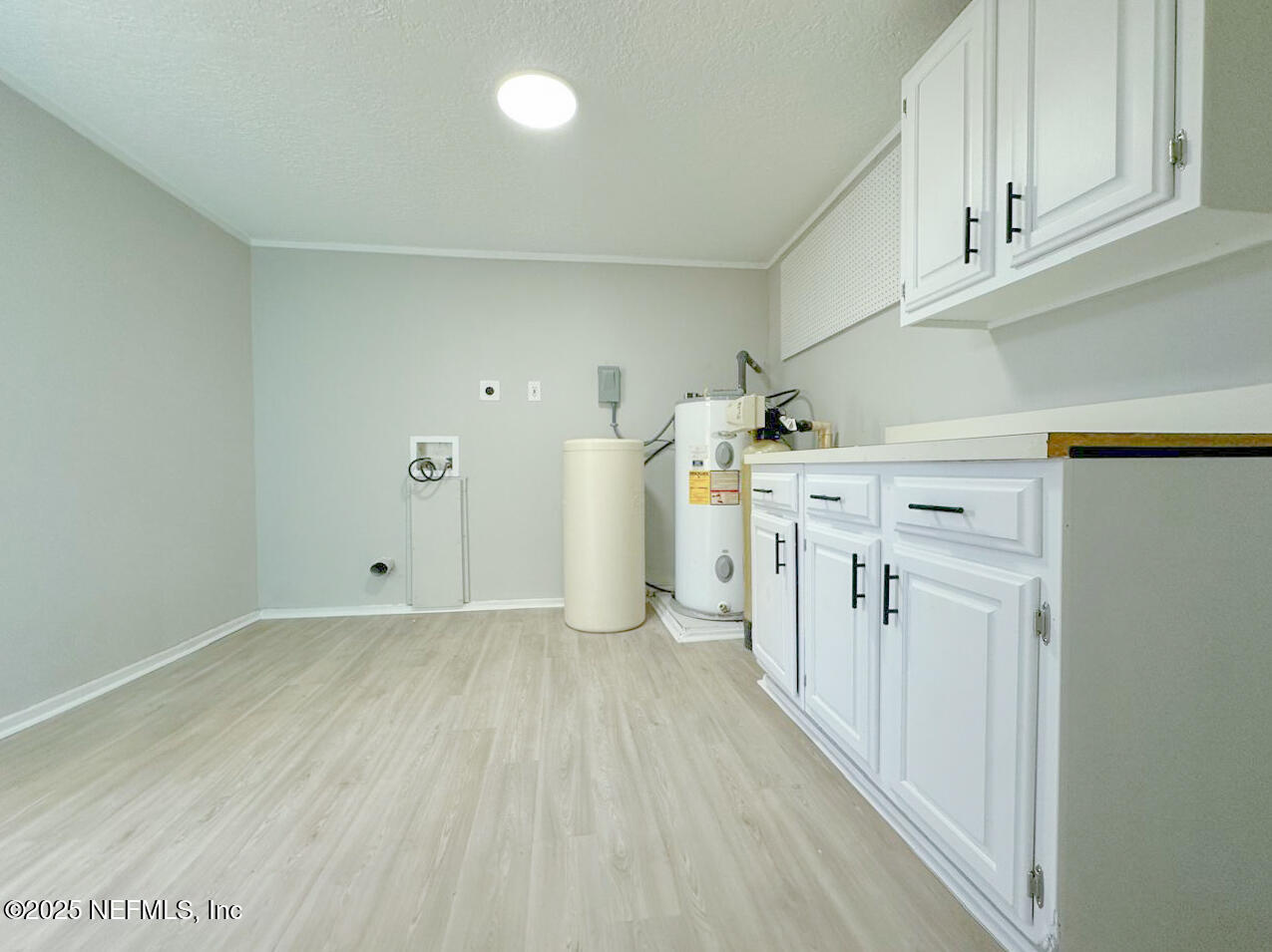 1336 Morgana Road Jacksonville, FL 32211 - Photo 32 of 36 a kitchen with a stove a refrigerator and cabinets