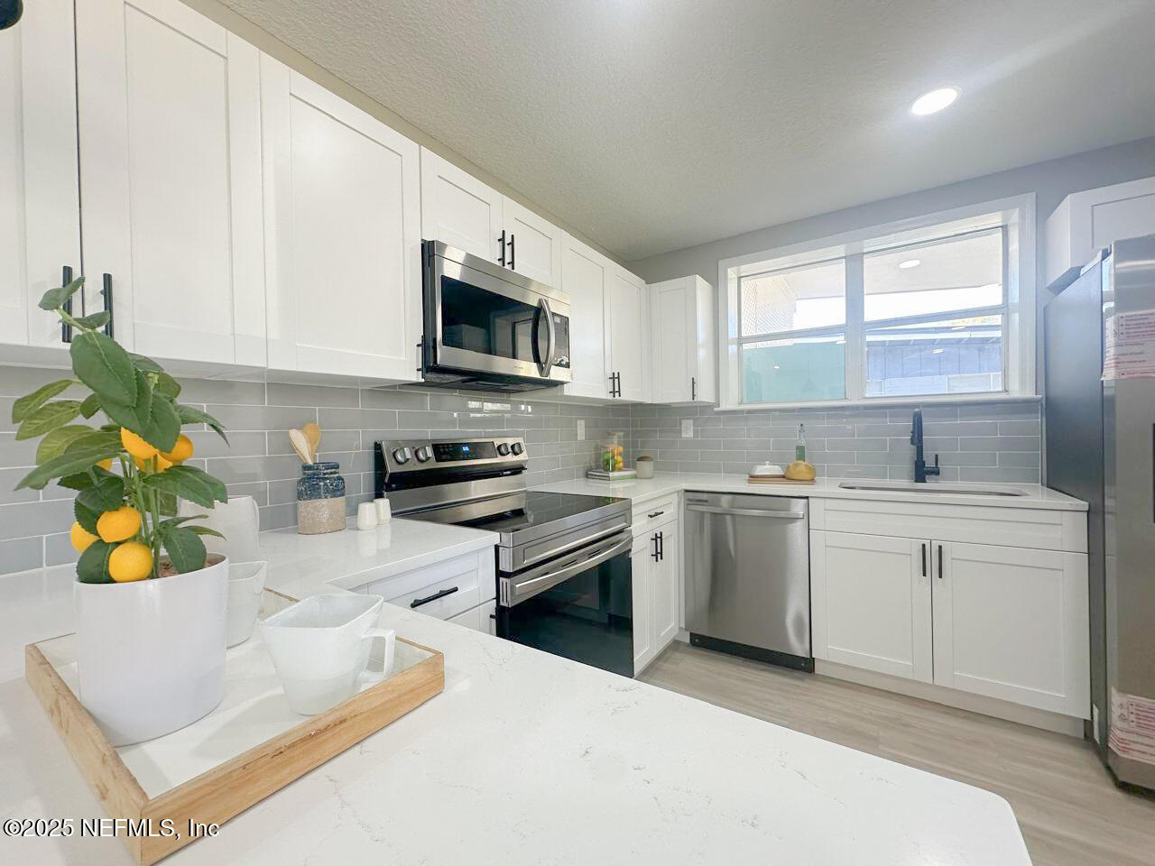 1336 Morgana Road Jacksonville, FL 32211 - Photo 7 of 36 a kitchen with a sink cabinets and window