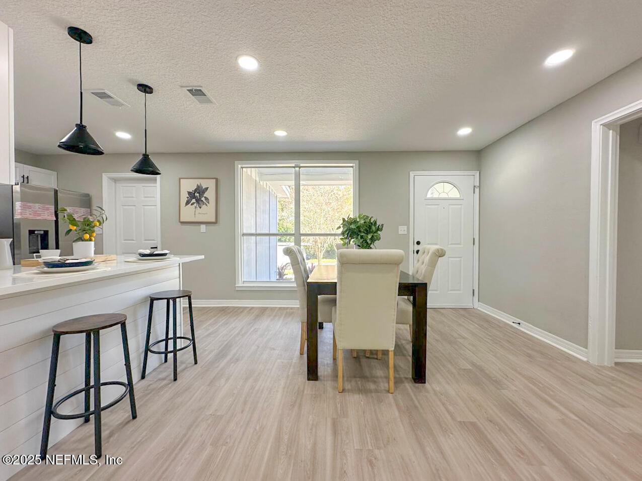 1336 Morgana Road Jacksonville, FL 32211 - Photo 10 of 36 a view of a dining room with furniture and wooden floor