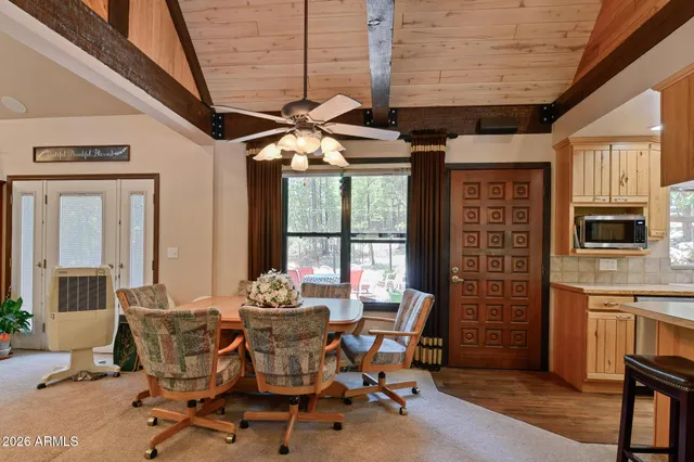 a dining room with furniture and window