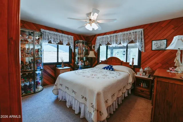 a bedroom with bed and window
