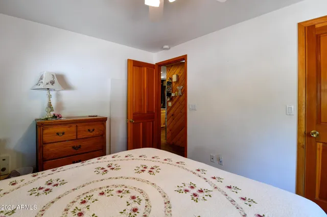 a bedroom with a bed and a dresser