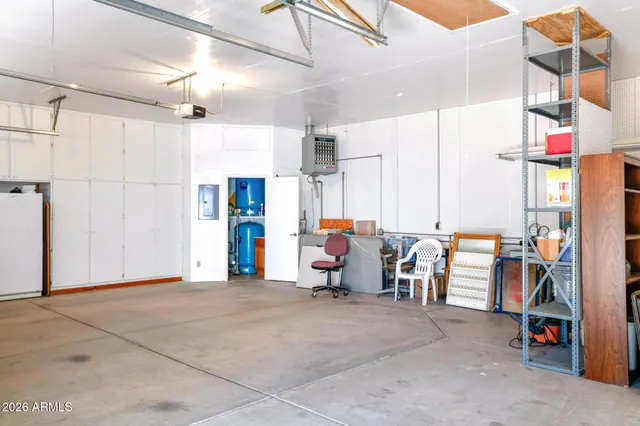 a bathroom with a sink mirror and vanity