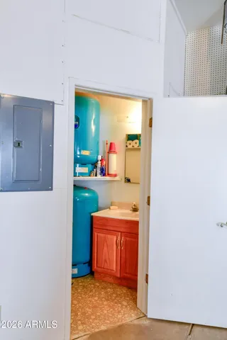 a bathroom with a toilet a sink and a mirror