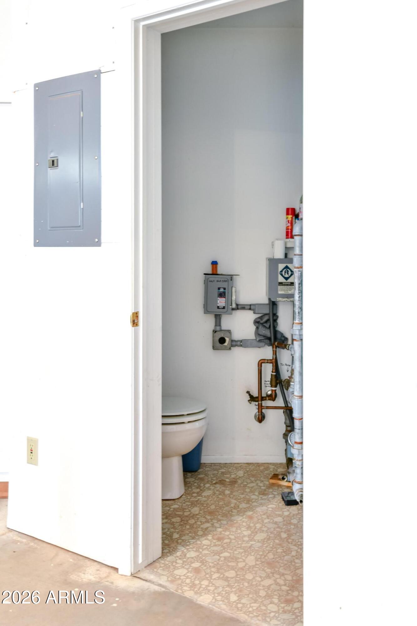 1018 Reata Pass Happy Jack, AZ 86024 - Photo 31 of 33 a bathroom with a toilet and a sink