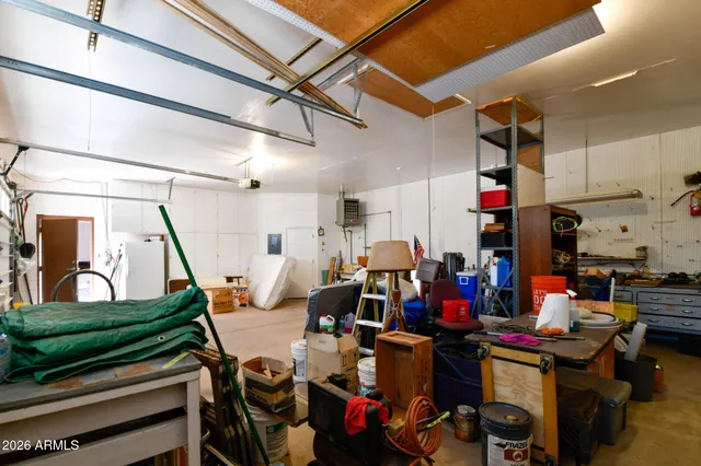 a view of a porch with furniture and floor to ceiling window