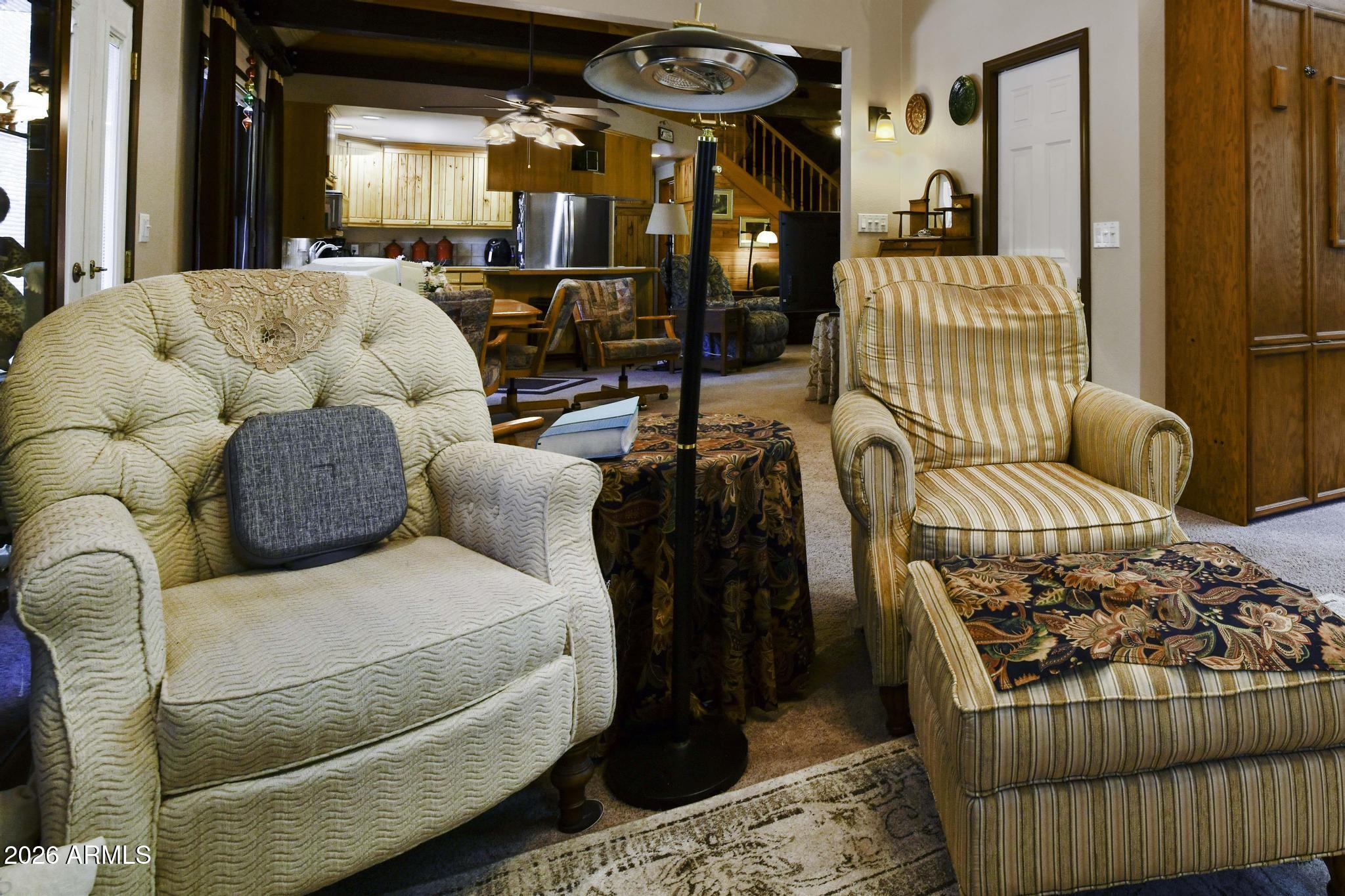 1018 Reata Pass Happy Jack, AZ 86024 - Photo 8 of 33 a living room with a couch and chandelier