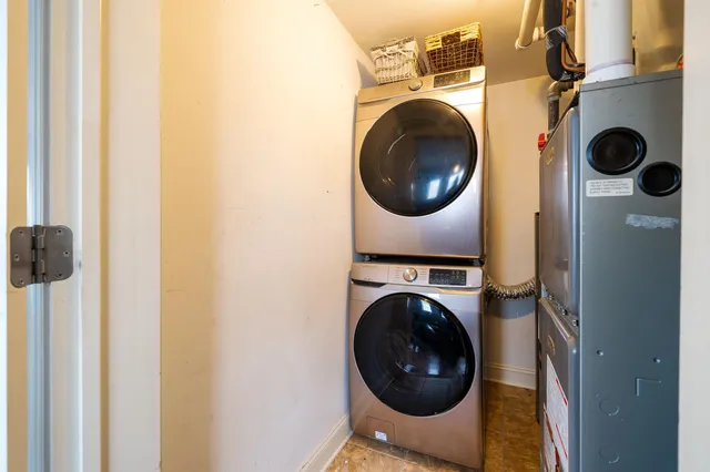 a view of a hallway with washer and dryer