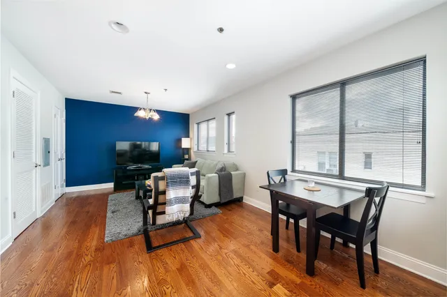 a workspace with furniture window and wooden floor