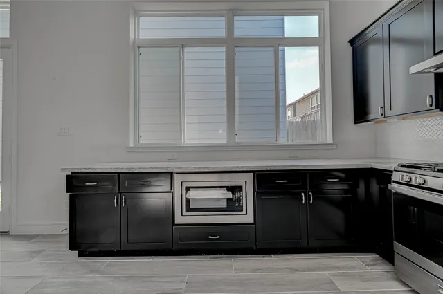 a view of cabinets and window