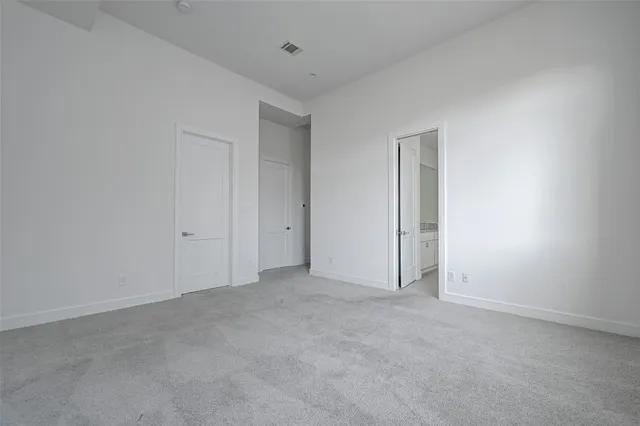 a spacious bathroom with a granite countertop sink and a bathtub