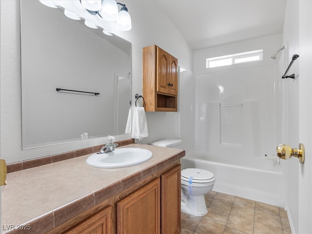 70 West Bonanza Road Las Vegas, NV 89124 - Photo 34 of 71 Full bath featuring vanity, toilet, and shower / tub combination