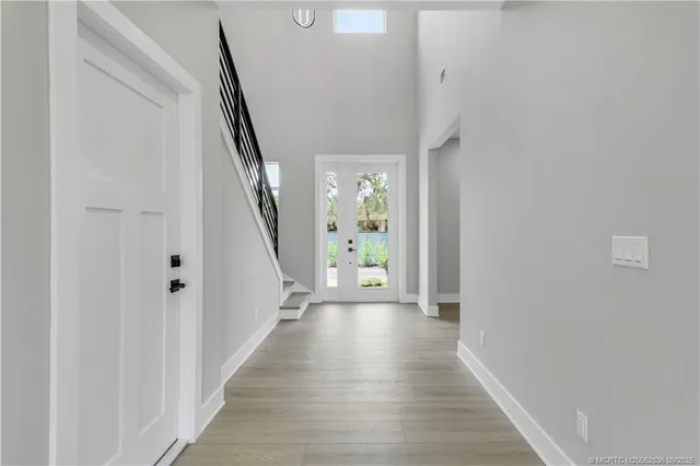a view of kitchen with refrigerator and window