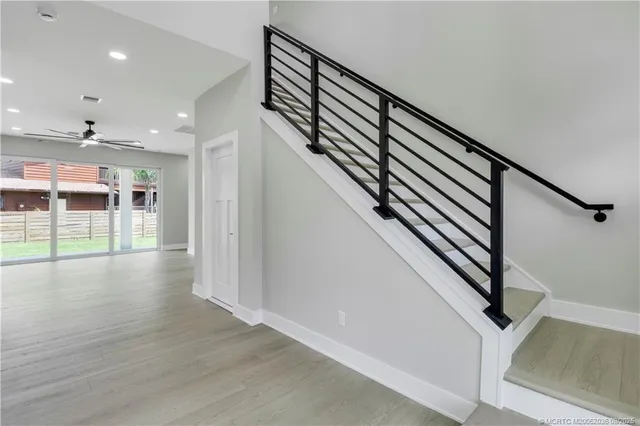a kitchen with stainless steel appliances granite countertop a sink and cabinets