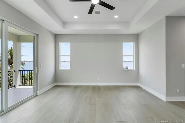 a view of hallway with wooden floor