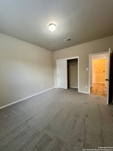 a view of a hallway with a window