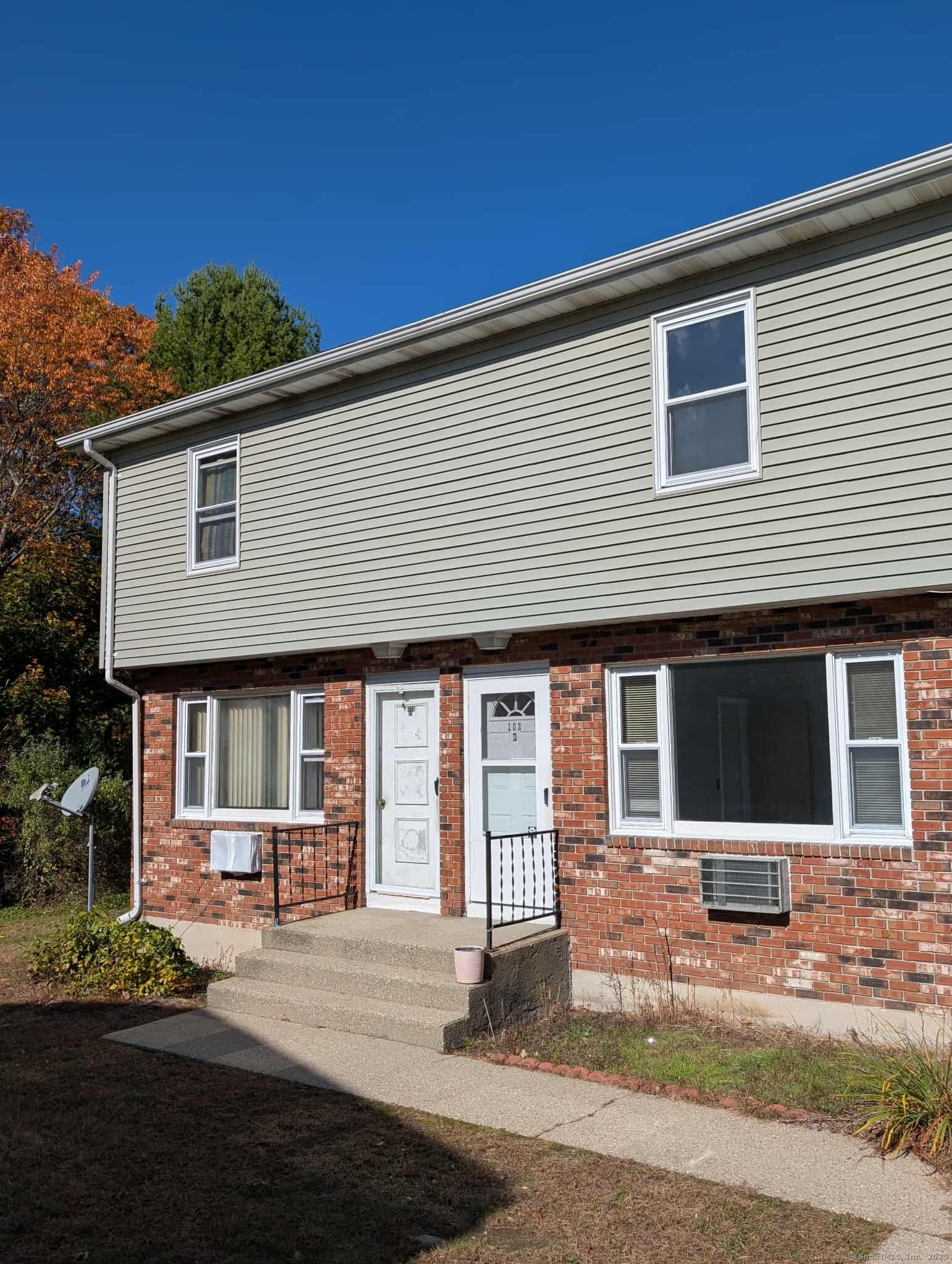102F Canterbury Road, Unit B Plainfield, CT 06374 - Photo 1 of 1 a front view of a house with a yard