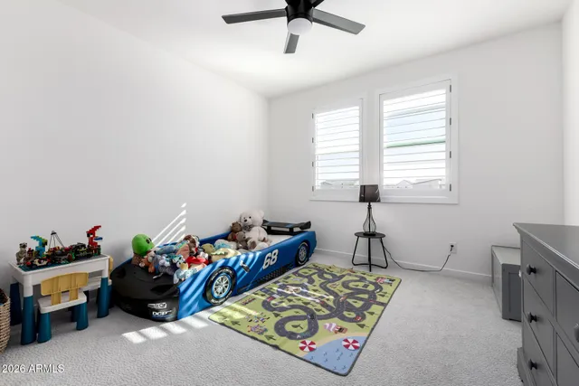 a bed room with furniture and a window