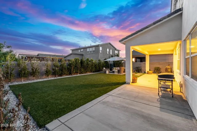 a view of a building with a yard