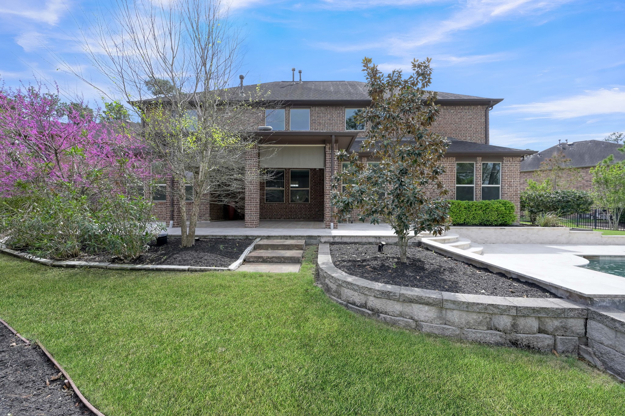 23219 Belted Kingfisher Trail Spring, TX 77389 - Photo 34 of 43 a front view of a house with garden