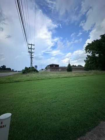 a view of a golf course with a lake