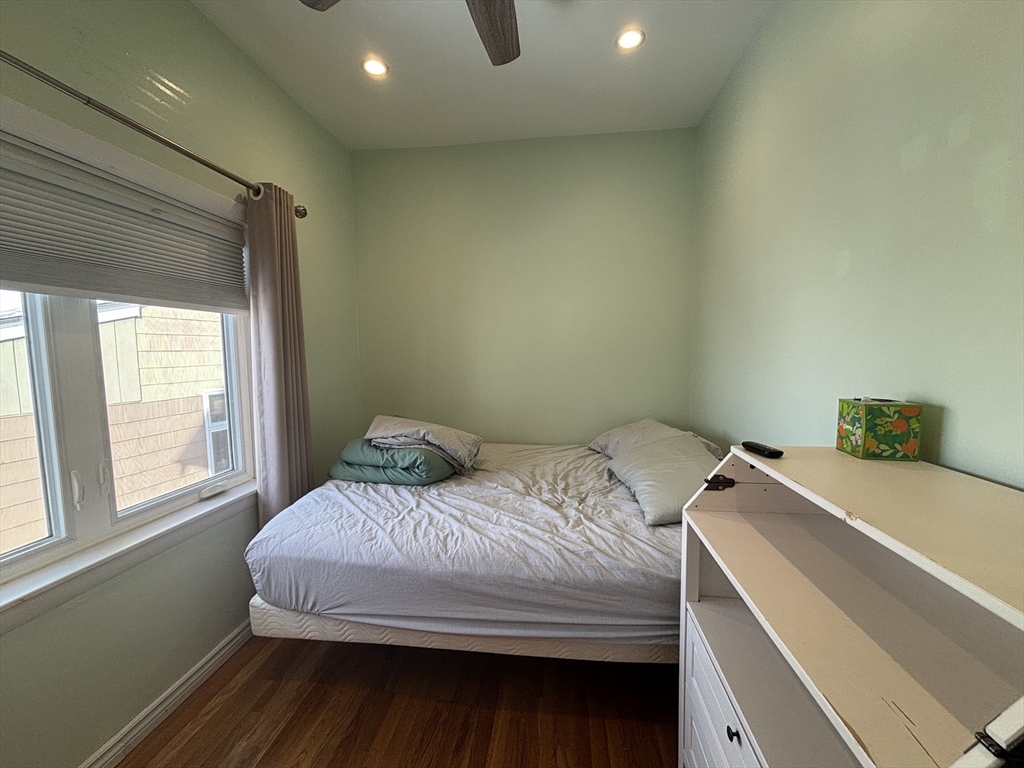 30 Alaric Street, Unit 2 Boston, MA 02132 - Photo 12 of 14 a bedroom with a bed and a window