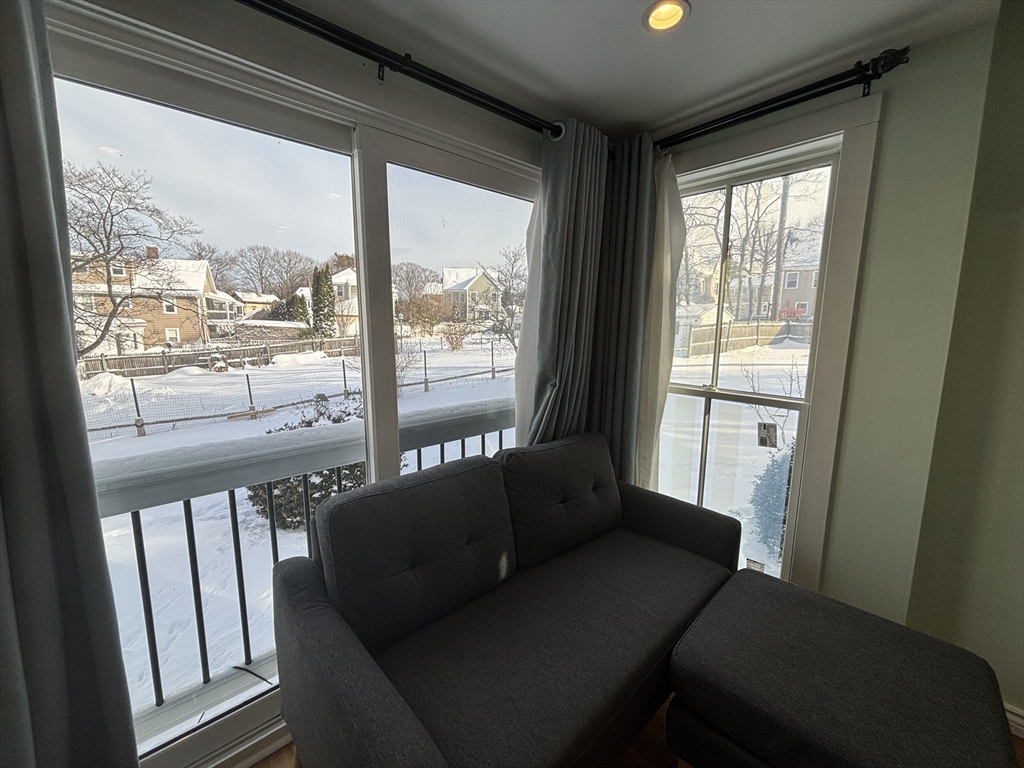30 Alaric Street, Unit 2 Boston, MA 02132 - Photo 3 of 14 a living room with furniture and a window