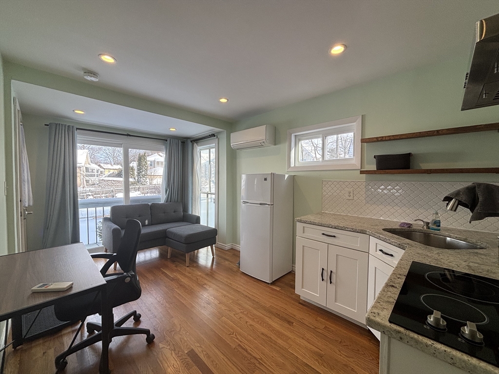 30 Alaric Street, Unit 2 Boston, MA 02132 - Photo 5 of 14 a kitchen with sink refrigerator and window