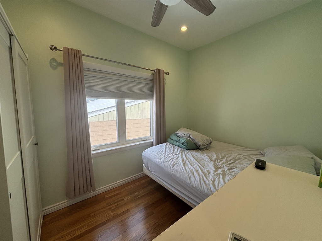 30 Alaric Street, Unit 2 Boston, MA 02132 - Photo 10 of 14 a bedroom with a bed and a window