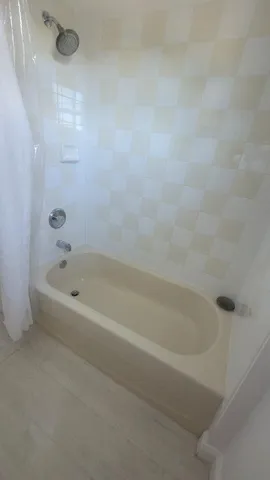 a close view of a bathtub in bathroom