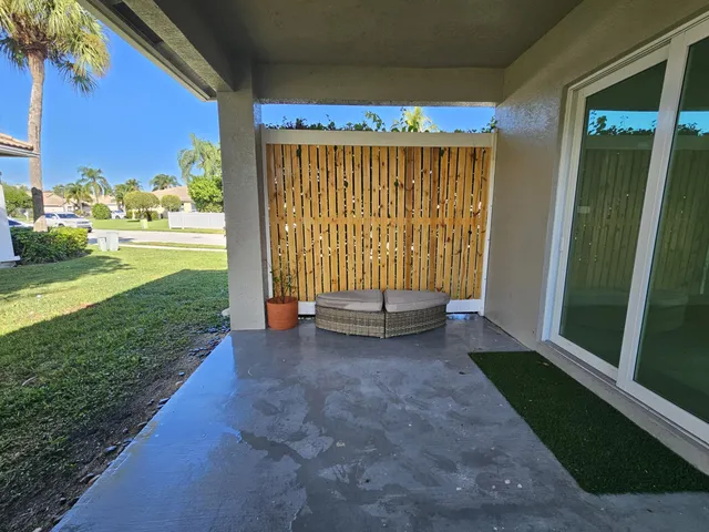 a view of backyard with porch