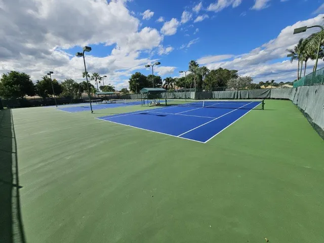 a bathroom with a sink a toilet and a utility room