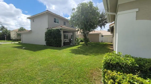 a view of a back yard of the house
